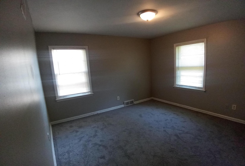 Spare room with carpet floors and plenty of natural light