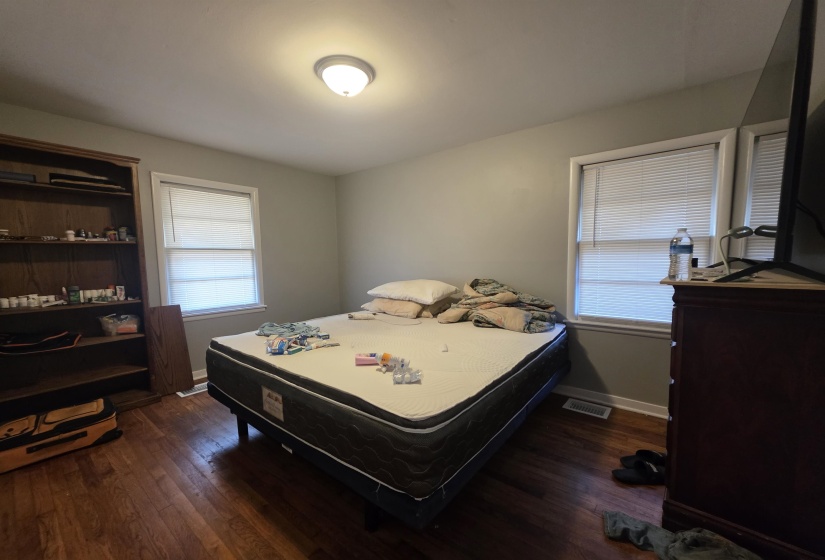 Hardwood-finish flooring throughout, complemented by light gray wall tones