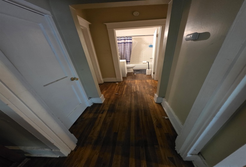 Hardwood-finish flooring extending through the hallway