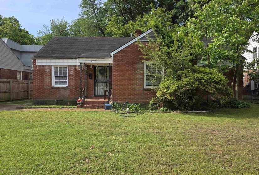 Brick exterior with a gabled roofline and a covered entry porch