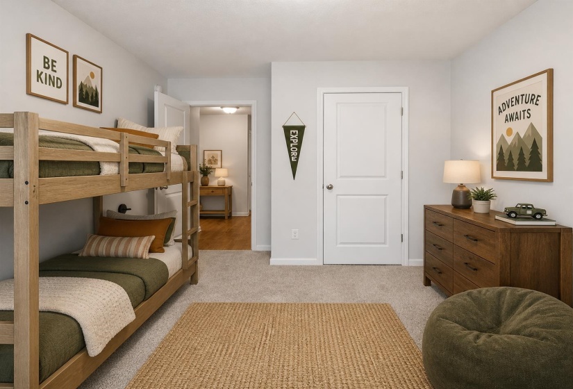 Carpeted room featuring a light color palette, a solid core door, and an entryway with wood-finish flooring