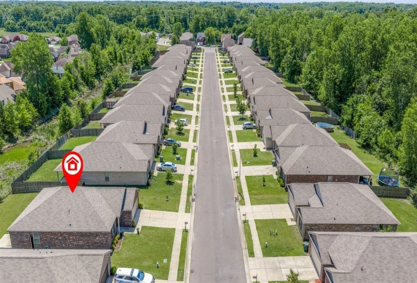 Aerial perspective showcasing a residential street with uniform single-story homes