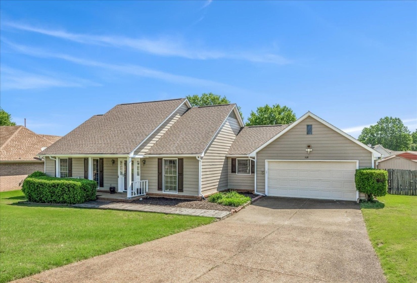 Ranch-style residence featuring light gray siding and a composition shingle roof