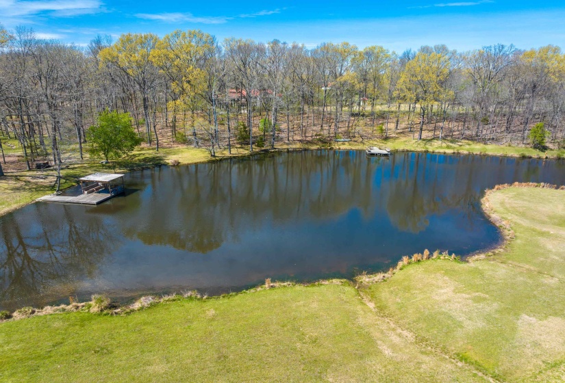 Property view of water with a floating dock