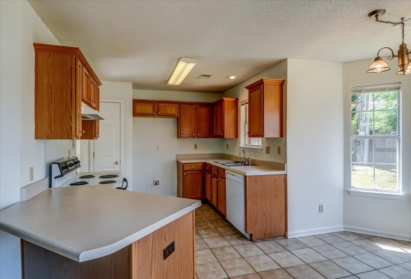 Kitchen area features a breakfast bar