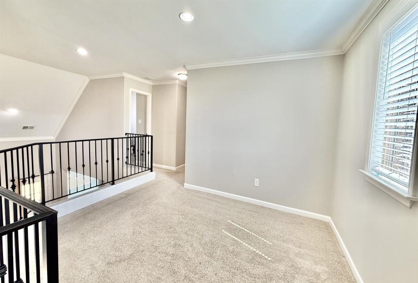 Empty room featuring carpet flooring, recessed lighting, and ornamental molding