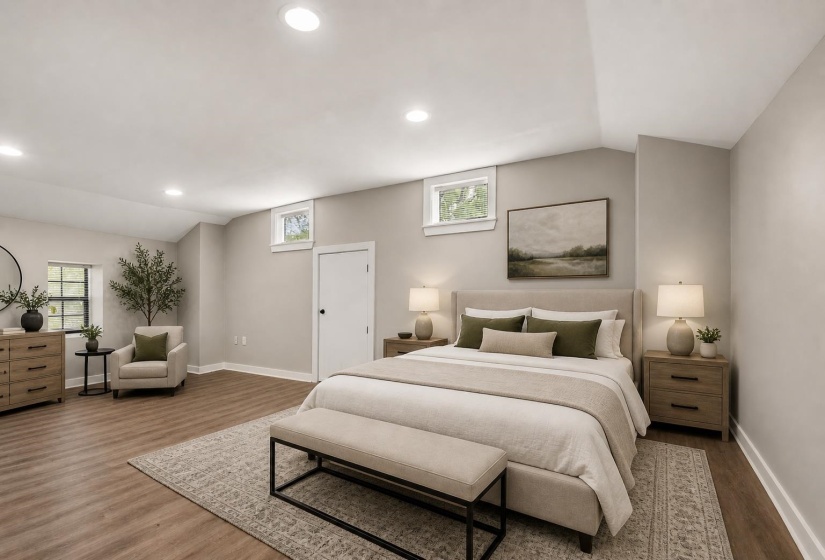 Spacious room featuring recessed lighting, light neutral wall tones, wood-finish flooring, and multiple windows