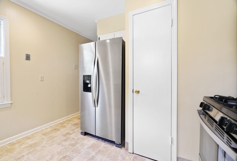 Kitchen featuring white cabinetry, new quartz countertops, and stainless steel appliances