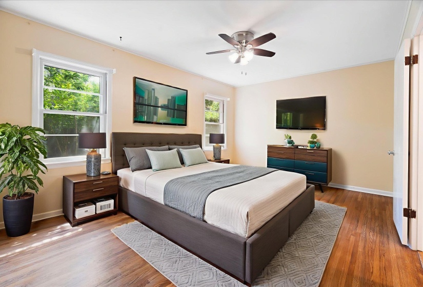 Bright interior featuring wood-finish flooring, light-toned walls, and white trim
