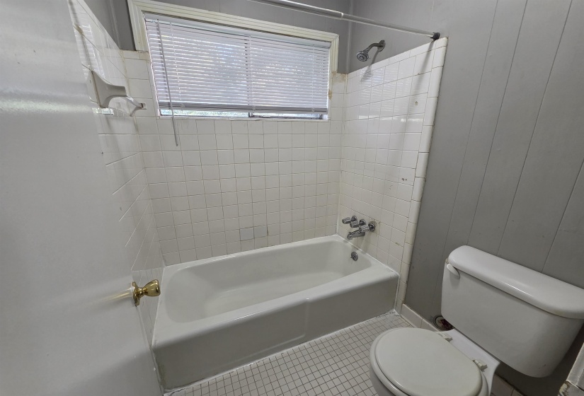 Full bathroom with tile patterned flooring and tub / shower combination