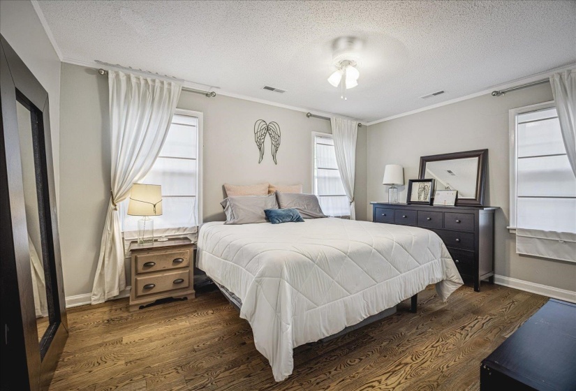 Spacious primary bedroom features two closets.