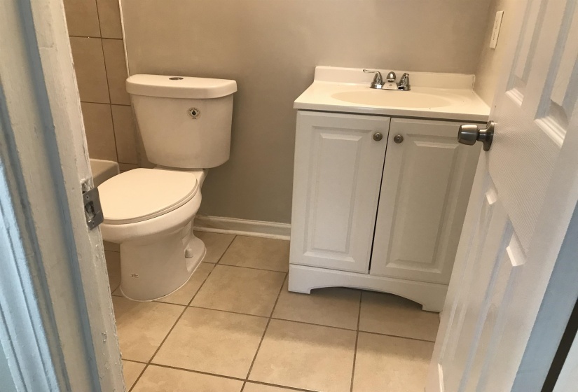 Bathroom featuring light tile patterned floors and vanity
