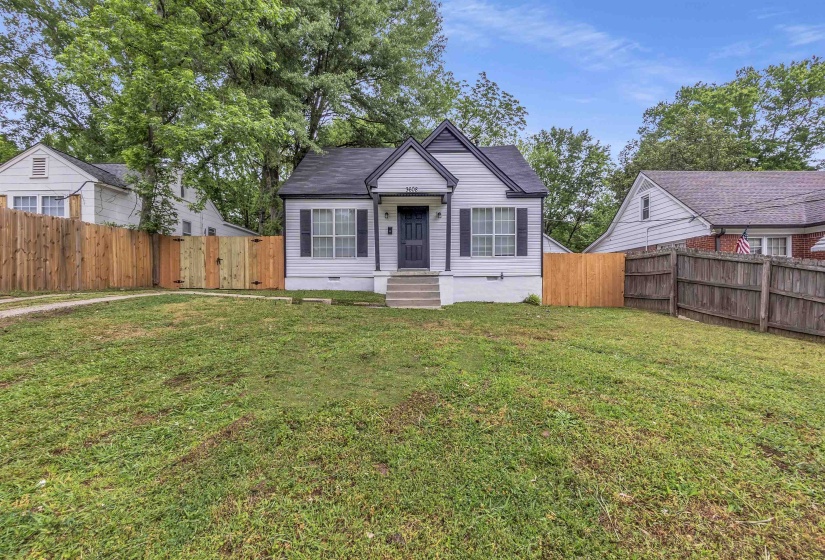 View of front facade with a fenced backyard and crawl space