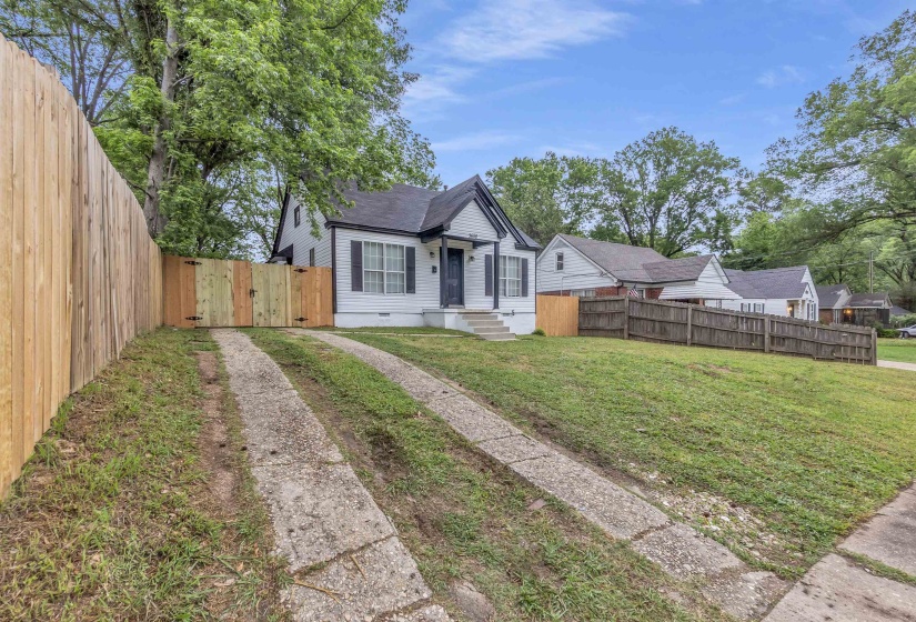 Bungalow-style home with a gate and crawl space