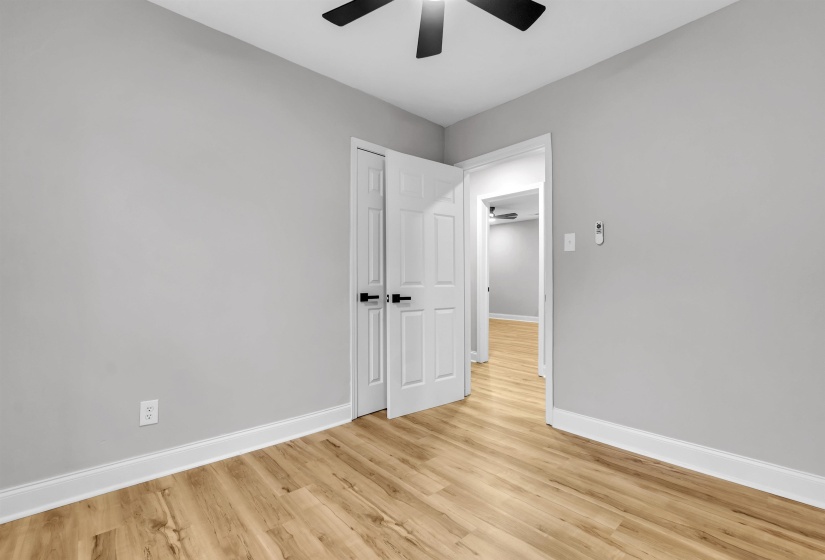 Unfurnished bedroom featuring light wood finished floors and a ceiling fan
