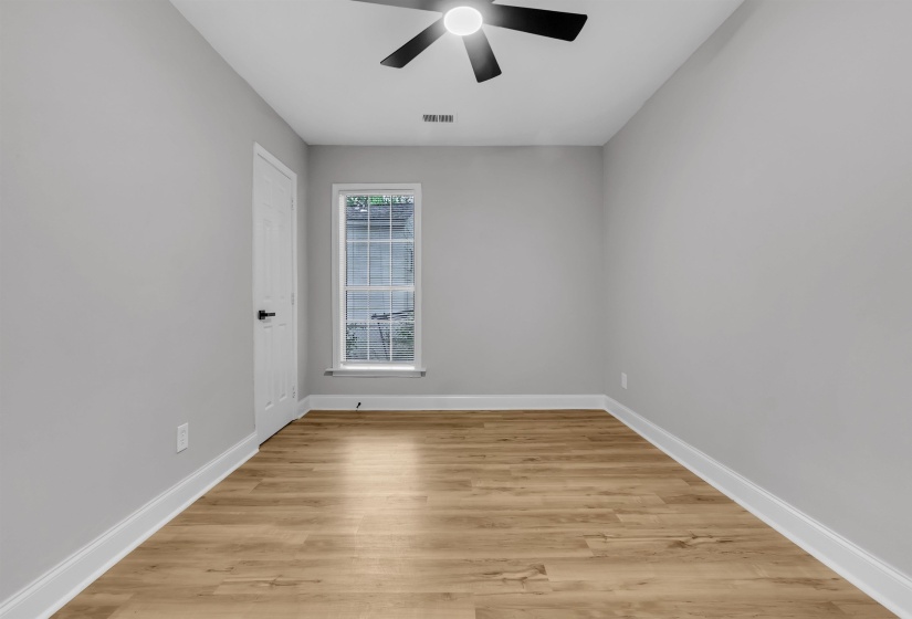 Unfurnished room with light wood-style floors and a ceiling fan