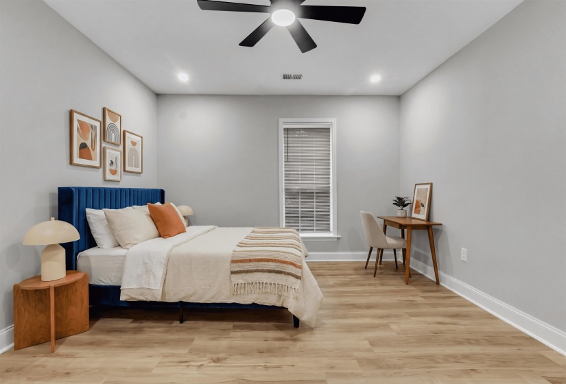 Bedroom with light wood-type flooring, recessed lighting, and ceiling fan