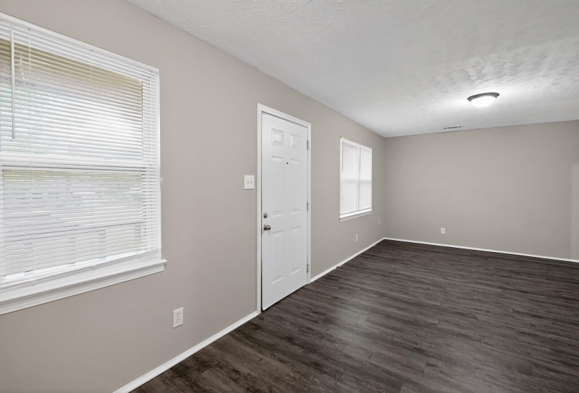 Spacious interior with dark wood-finish flooring