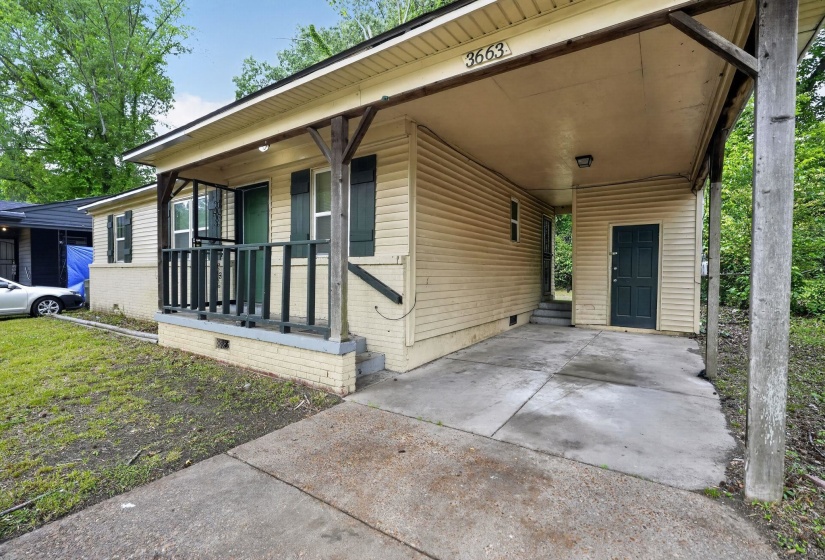Single-story residence featuring light-colored siding and a covered front porch with dark railings