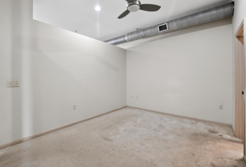 Room featuring light-colored walls, exposed ductwork, a ceiling fan, and recessed lighting