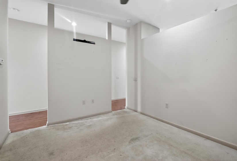 Interior space featuring light-toned walls, recessed lighting, and a ceiling fan