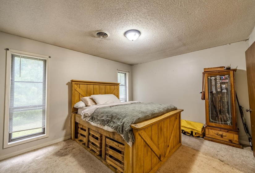 Room featuring light neutral wall paint and textured ceiling