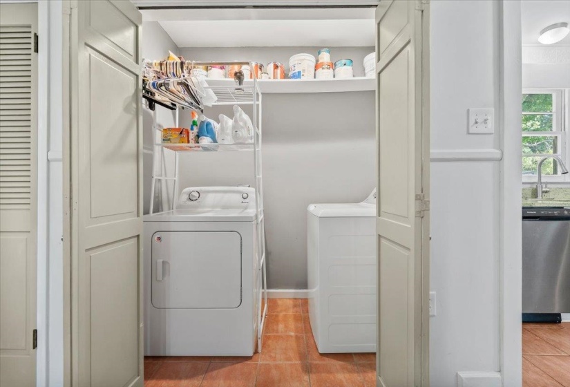Laundry room inside the home with extra storage space.