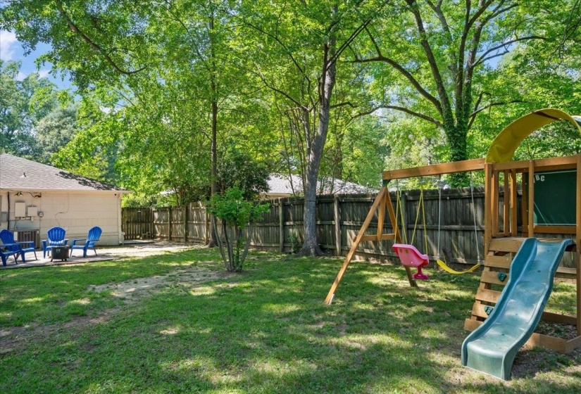 Large backyard with swingset.