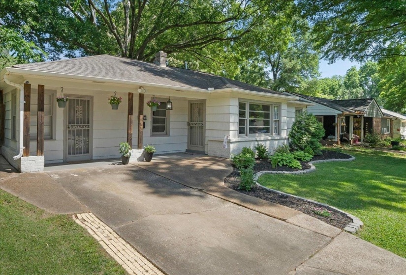 Super cute porch and beautifully landscaped.