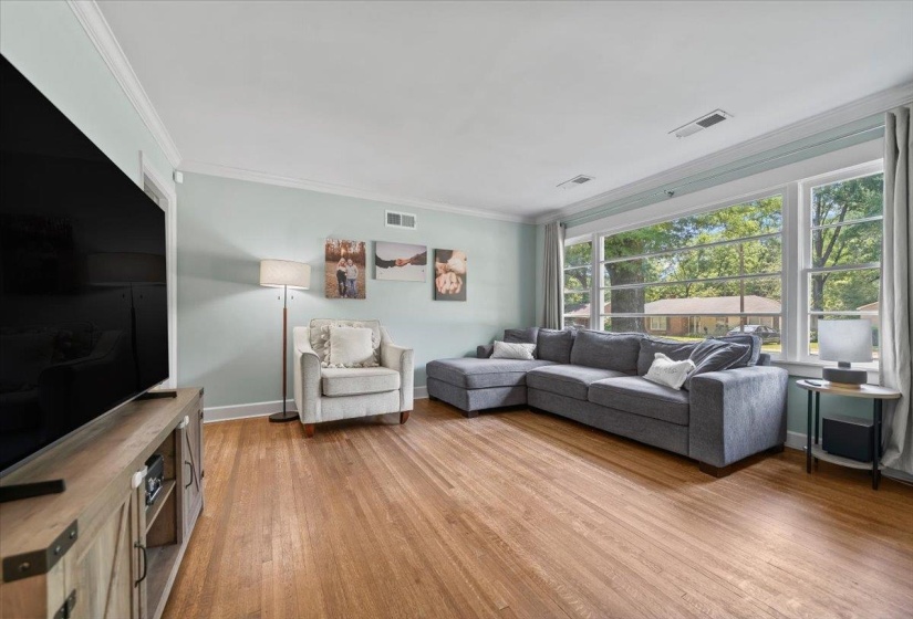Spacious den with beautiful hardwood floors.