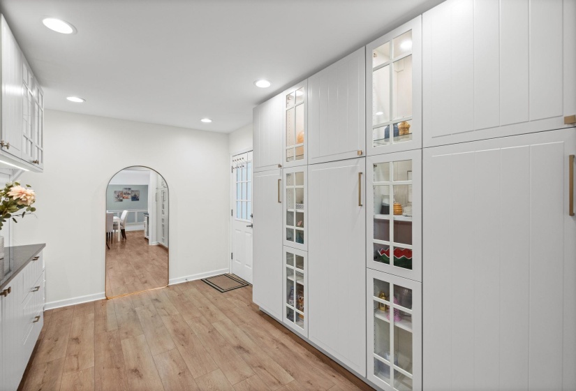 15x10 renovated space off of the kitchen that could be used as a sitting/living space, home office, dining area, expansion of kitchen, large laundry room, or whatever you desire!