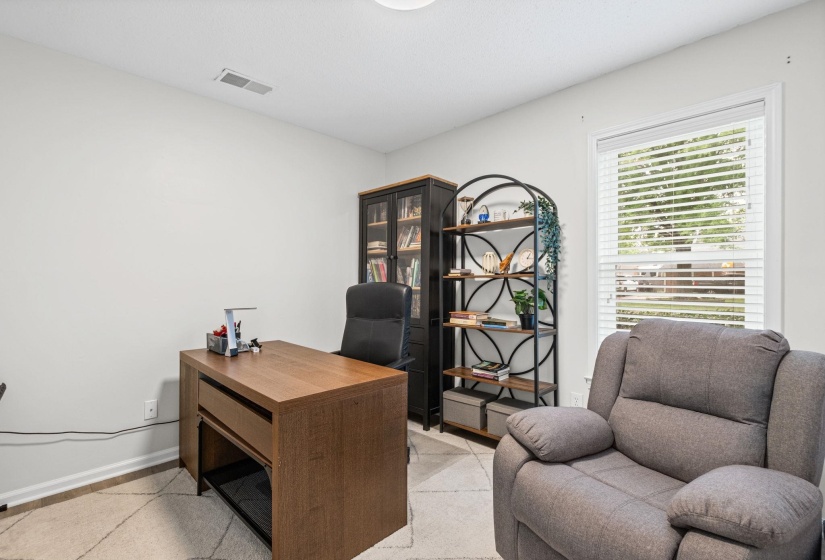 Bedroom on first level currently being used as a home office.