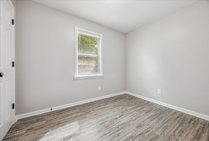 Unfurnished room featuring wood finished floors