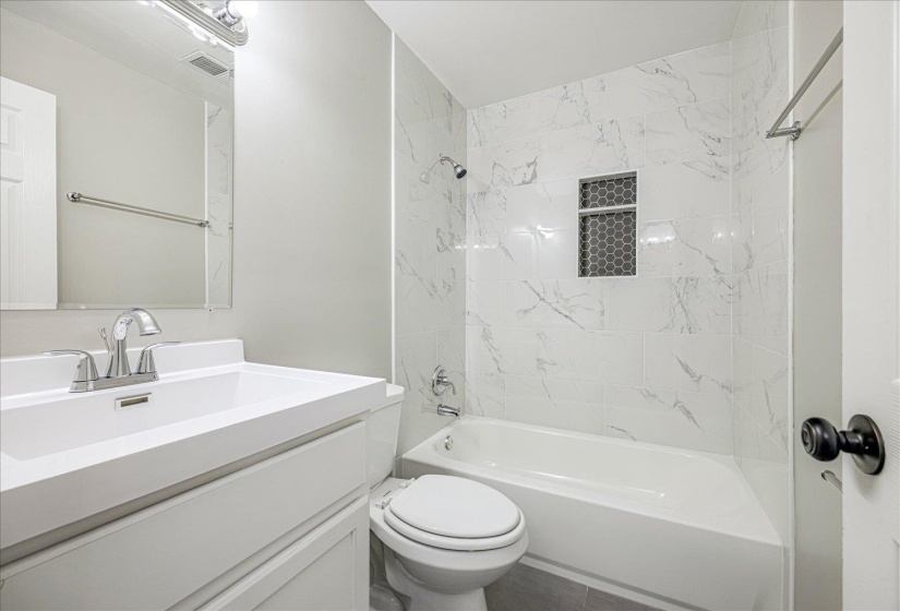 Full bath with shower / tub combination and vanity