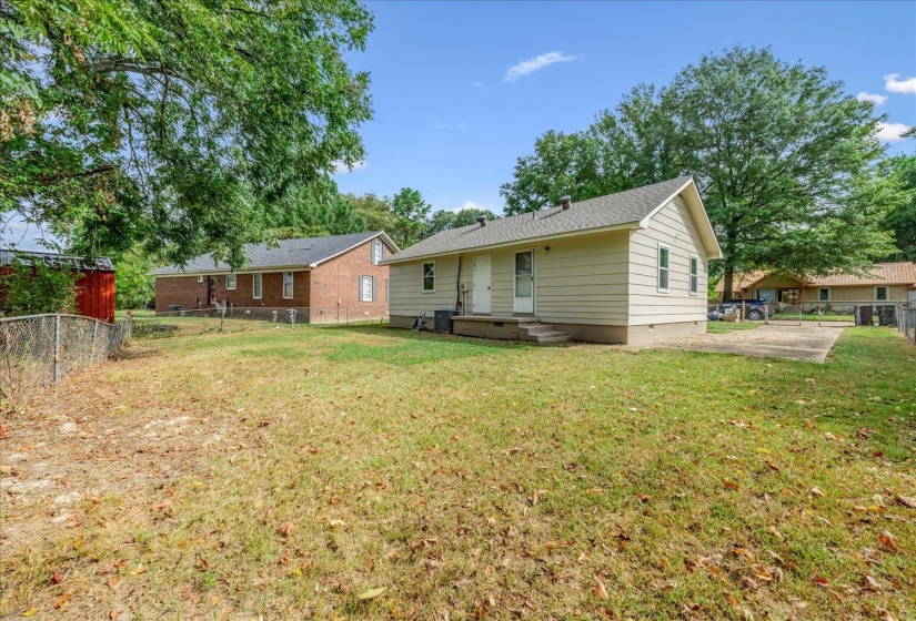 Back of house with crawl space and a patio area