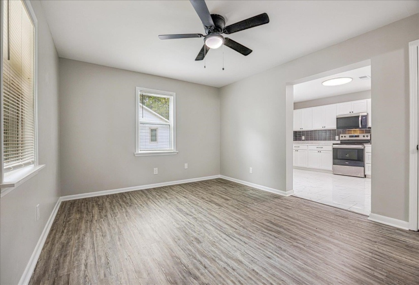 Spare room with light wood-style flooring and a ceiling fan