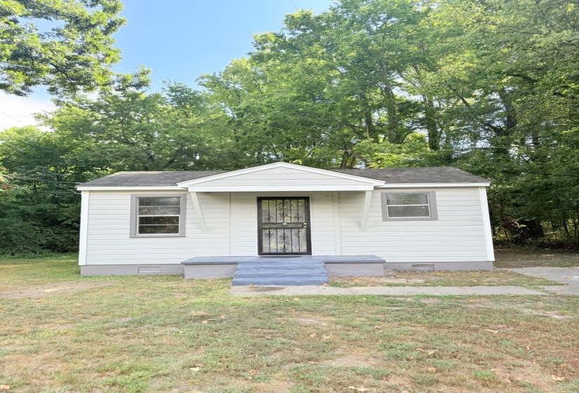 Bungalow with crawl space, a front yard, and view of scattered trees
