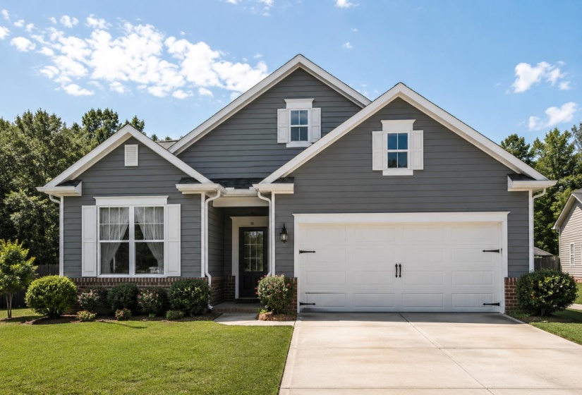 Charcoal gray siding exterior with white trim accents and architectural roofline