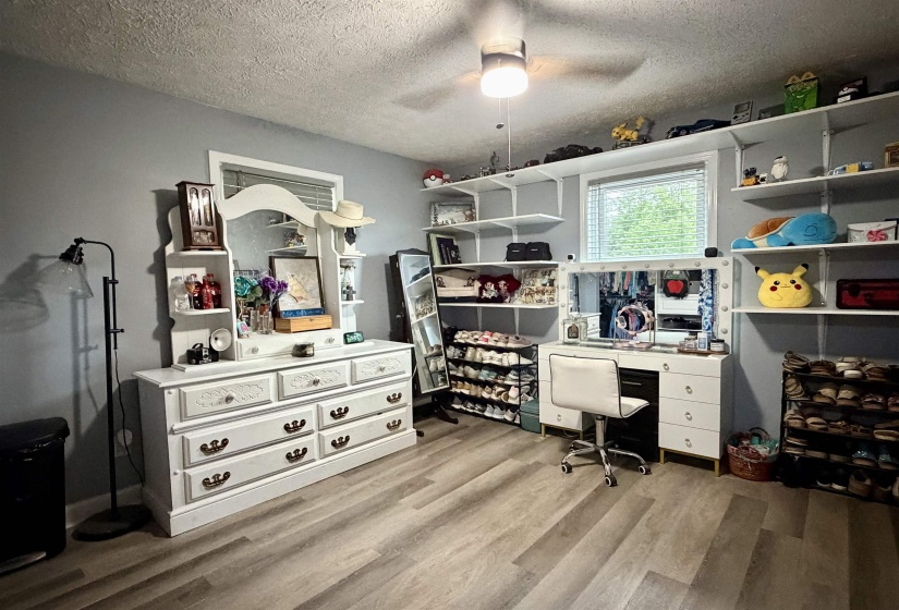 Light wood-finish flooring with light gray walls