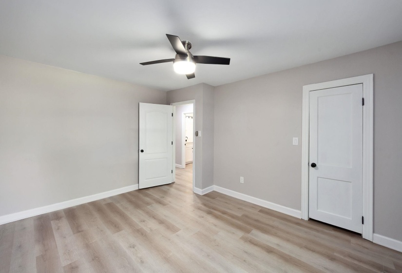 Neutral wall tones paired with light wood-finish flooring