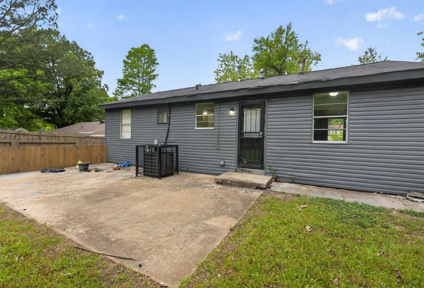 Exterior siding in a neutral tone, featuring multiple windows for natural light