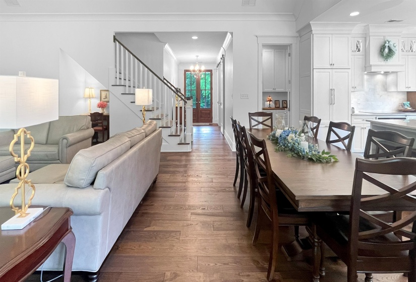 Open concept living area featuring wood-finish flooring throughout