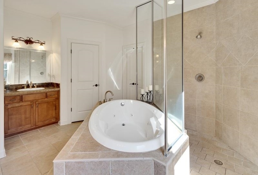 Enclosed shower with full-height tile surround and glass panels