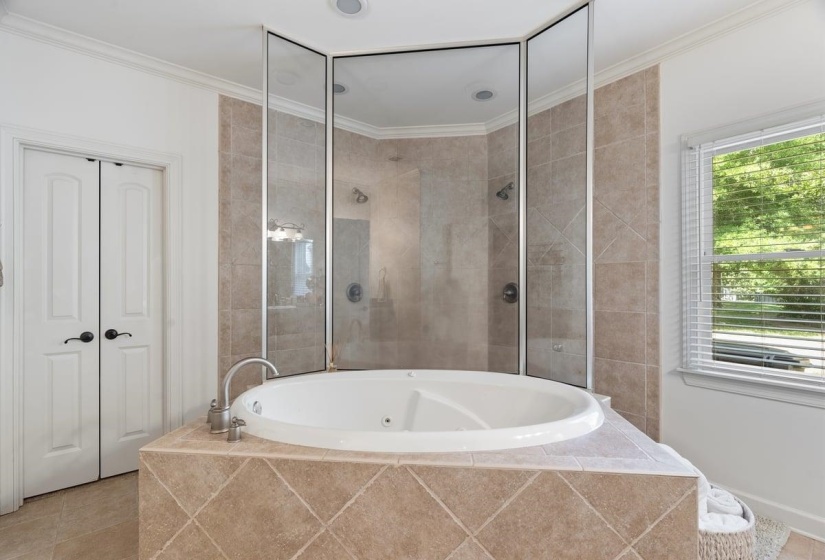 Built-in jacuzzi tub with walk through sower and dual shower heads