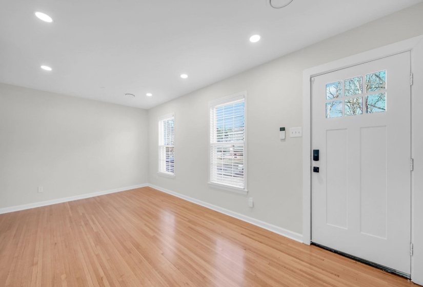 Entryway with recessed lighting and light wood finished floors