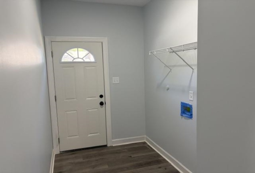 Separate laundry room with side door access