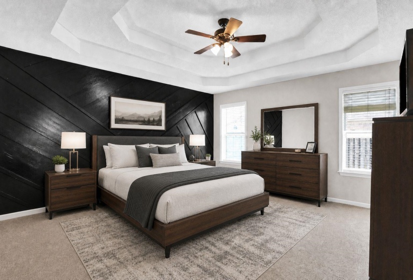 Bedroom featuring light colored carpet, ceiling fan, wood walls, a tray ceiling, and refrigerator