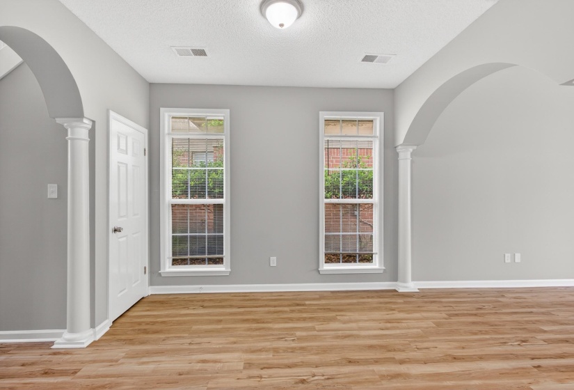 Interior room featuring wood-finish flooring and light gray walls