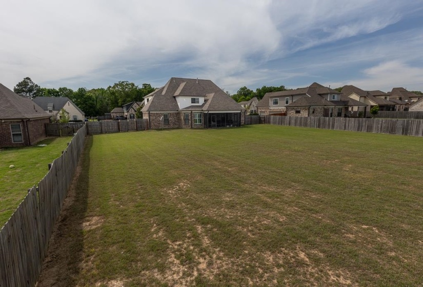 Expansive backyard featuring a large green space