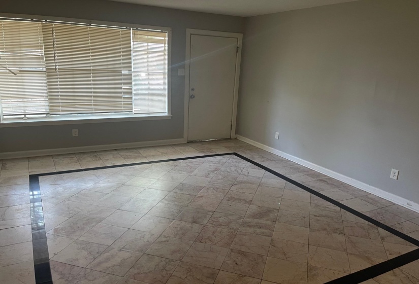 Empty room featuring baseboards